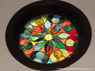 one of the beautiful stained glass windows in the historic Collbran Congregational United Church of Christ